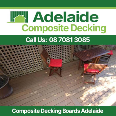Modern composite deck installation in Adelaide featuring wood grain planks with red chairs